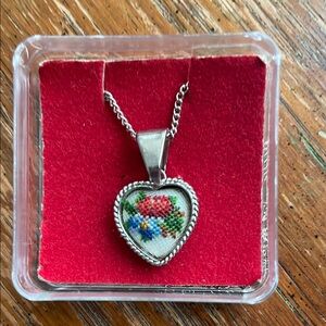Heart-Shaped Silver Pendant with Floral Design